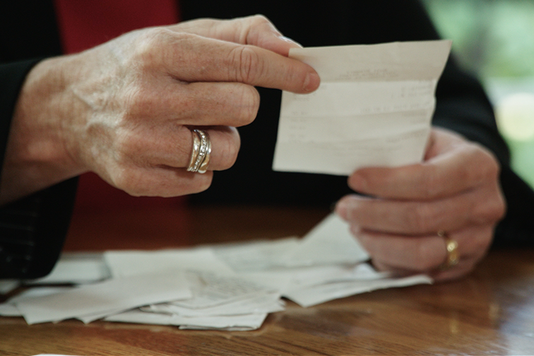 Woman reading receipt